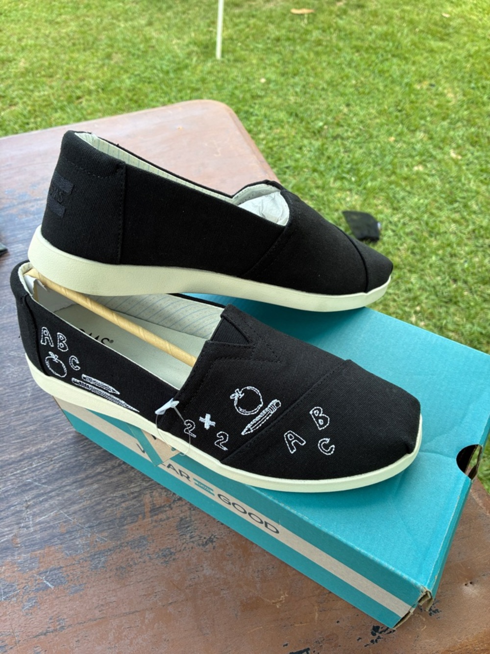 Toms Black Canvas Slip-On Flats with White Embroidered Doodle